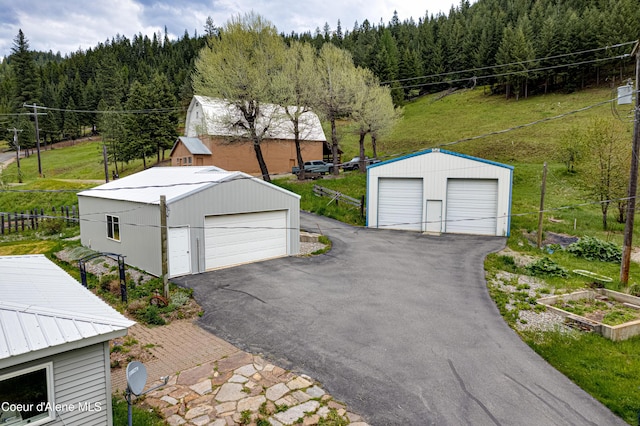 59A Creek Side Dr, Wallace, ID 83873 - detached garage featuring a forest view