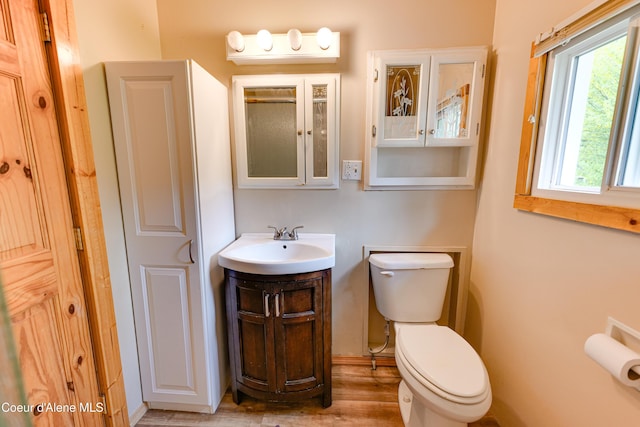 59A Creek Side Dr, Wallace, ID 83873 - bathroom with toilet, vanity, wood finished floors, and baseboards