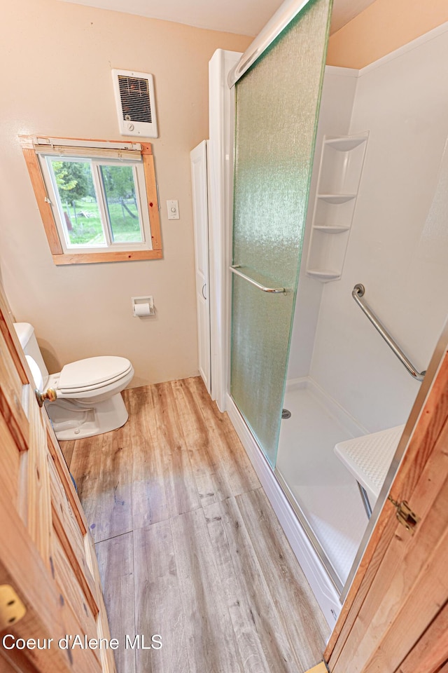 59A Creek Side Dr, Wallace, ID 83873 - full bath with wood finished floors, a shower stall, toilet, and heating unit