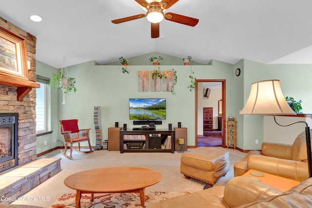 5340 W Hull Loop, Coeur Dalene, ID 83814 - living room with vaulted ceiling, a stone fireplace, a ceiling fan, light colored carpet, and baseboards