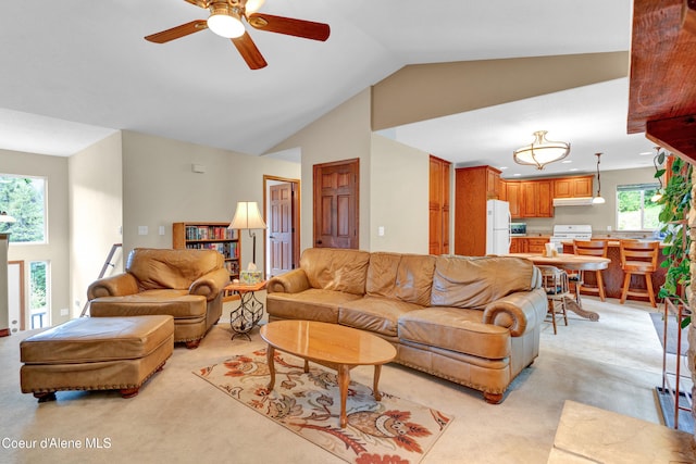 5340 W Hull Loop, Coeur Dalene, ID 83814 - living area with light colored carpet, ceiling fan, and vaulted ceiling