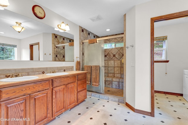 5340 W Hull Loop, Coeur Dalene, ID 83814 - full bathroom with plenty of natural light, a shower stall, double vanity, and tile patterned floors