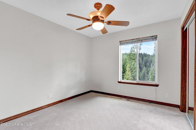 5340 W Hull Loop, Coeur Dalene, ID 83814 - carpeted spare room featuring baseboards and ceiling fan