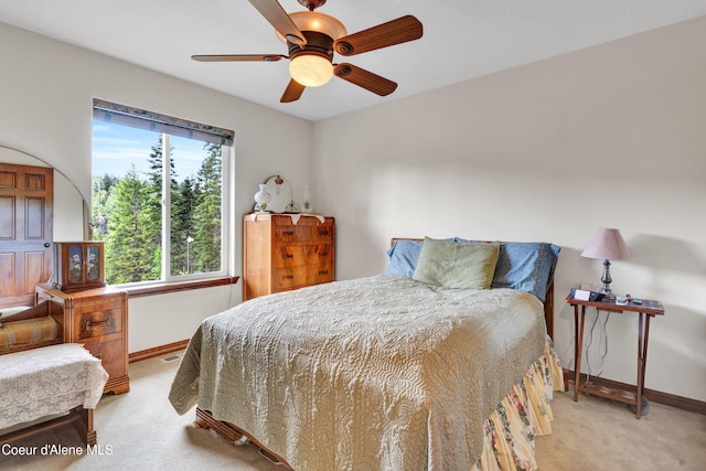 5340 W Hull Loop, Coeur Dalene, ID 83814 - bedroom featuring light colored carpet, baseboards, and ceiling fan