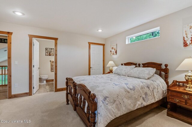88 Fenway Dr, Sagle, ID 83860 - bedroom featuring light colored carpet, baseboards, recessed lighting, and connected bathroom