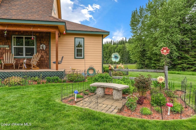 88 Fenway Dr, Sagle, ID 83860 - view of grassy yard featuring a porch