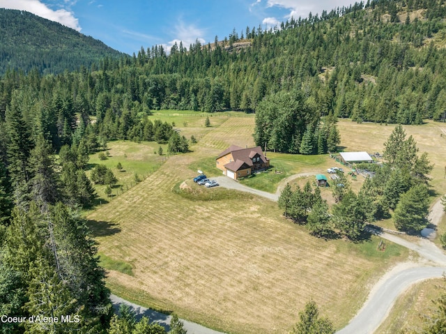 88 Fenway Dr, Sagle, ID 83860 - aerial view of property and surrounding area with a heavily wooded area and a mountain backdrop