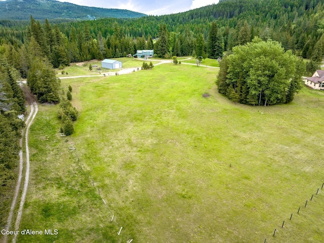 88 Fenway Dr, Sagle, ID 83860 - drone / aerial view of a heavily wooded area and a mountainous background