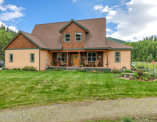 88 Fenway Dr, Sagle, ID 83860 - view of front of home featuring covered porch and a front lawn