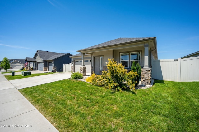 4717 N Connery Loop, Post Falls, ID 83854 - prairie-style home with concrete driveway, an attached garage, stone siding, and a residential view