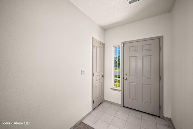 4717 N Connery Loop, Post Falls, ID 83854 - foyer featuring baseboards and light tile patterned floors