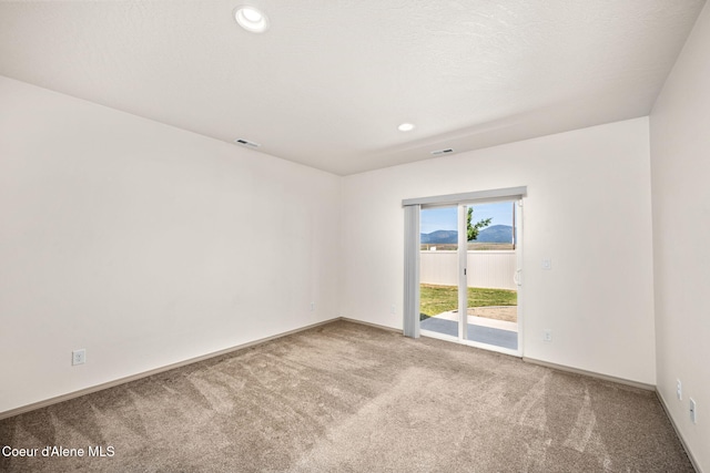 4717 N Connery Loop, Post Falls, ID 83854 - carpeted spare room with baseboards and recessed lighting