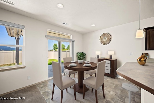 4717 N Connery Loop, Post Falls, ID 83854 - dining room featuring light stone finish flooring and recessed lighting
