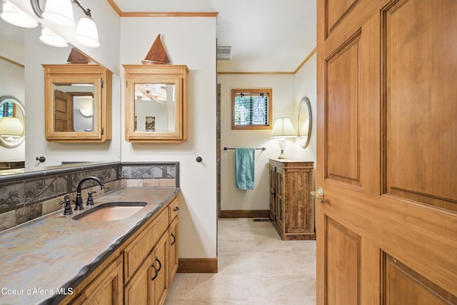 471 Kaniksu Shores Rd, Sandpoint, ID 83864 - bathroom with two vanities, baseboards, and ornamental molding