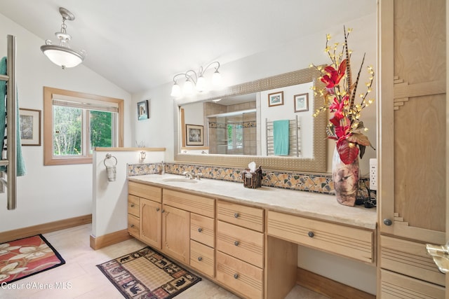 471 Kaniksu Shores Rd, Sandpoint, ID 83864 - bathroom with lofted ceiling, a shower stall, vanity, and baseboards