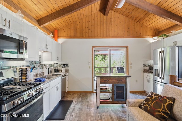471 Kaniksu Shores Rd, Sandpoint, ID 83864 - kitchen featuring stainless steel appliances, a sink, light wood-type flooring, wood ceiling, and white cabinets