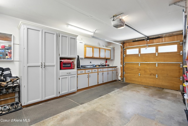 471 Kaniksu Shores Rd, Sandpoint, ID 83864 - garage with a garage door opener and a sink