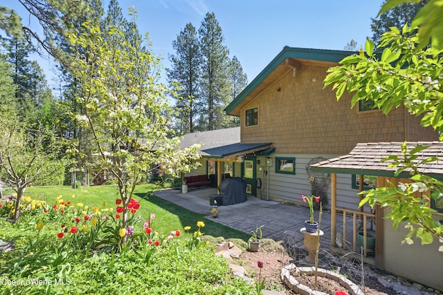 471 Kaniksu Shores Rd, Sandpoint, ID 83864 - back of property with a patio and a yard