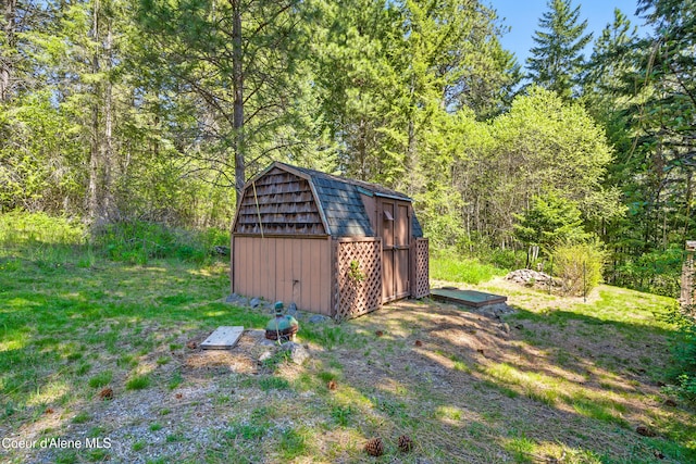 471 Kaniksu Shores Rd, Sandpoint, ID 83864 - view of shed featuring a wooded view
