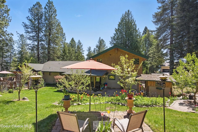 471 Kaniksu Shores Rd, Sandpoint, ID 83864 - back of property with a patio and a lawn
