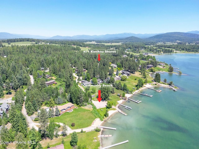 471 Kaniksu Shores Rd, Sandpoint, ID 83864 - aerial view of property's location featuring a water and mountain view and a heavily wooded area