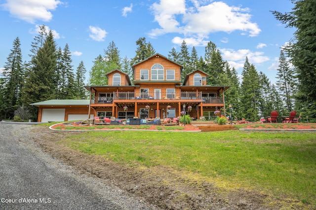 6918 E Garwood Rd, Hayden, ID 83835 - view of front of house with a garage, a front lawn, and driveway