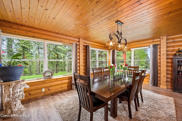 6918 E Garwood Rd, Hayden, ID 83835 - dining space with rustic walls, wood ceiling, and wood-type flooring