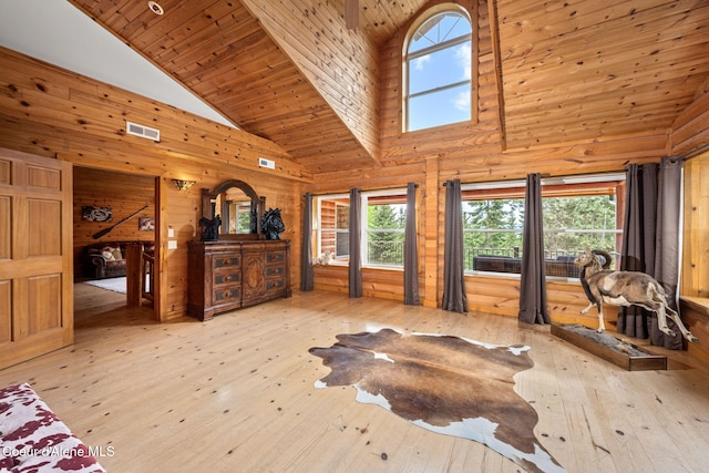 6918 E Garwood Rd, Hayden, ID 83835 - bedroom with high vaulted ceiling, wood-type flooring, wooden ceiling, and wood walls