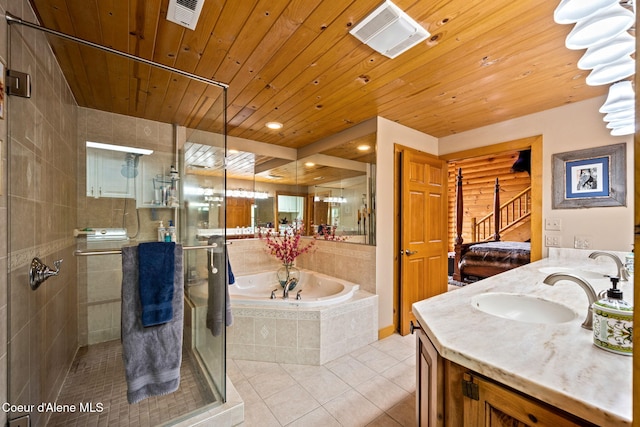 6918 E Garwood Rd, Hayden, ID 83835 - bathroom with tile patterned floors, vanity, a bath, a stall shower, and wood ceiling