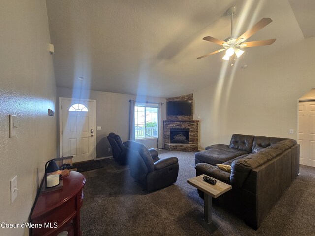 10566 N Seaside St, Hayden, ID 83835 - living area featuring carpet floors, lofted ceiling, ceiling fan, and a fireplace