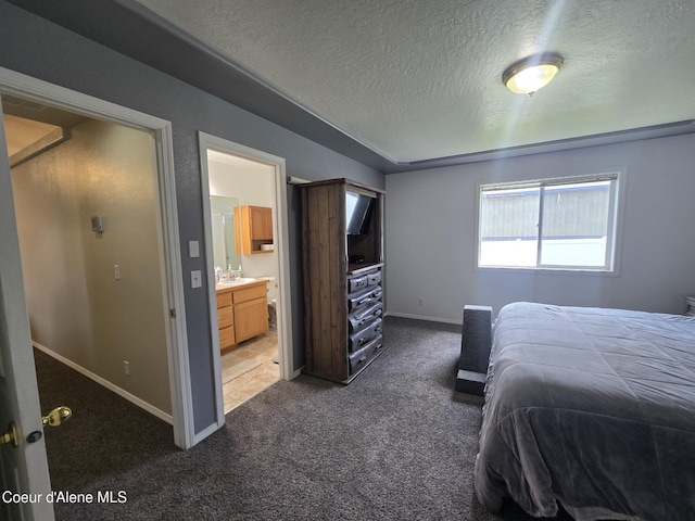 10566 N Seaside St, Hayden, ID 83835 - bedroom with carpet flooring, baseboards, a textured ceiling, and connected bathroom