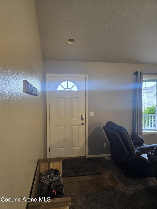 10566 N Seaside St, Hayden, ID 83835 - tiled foyer featuring a textured ceiling