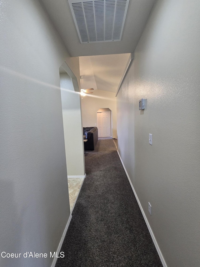 10566 N Seaside St, Hayden, ID 83835 - hall featuring carpet, baseboards, and arched walkways