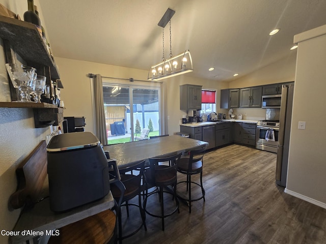 10566 N Seaside St, Hayden, ID 83835 - dining area with lofted ceiling, dark wood-style flooring, and recessed lighting