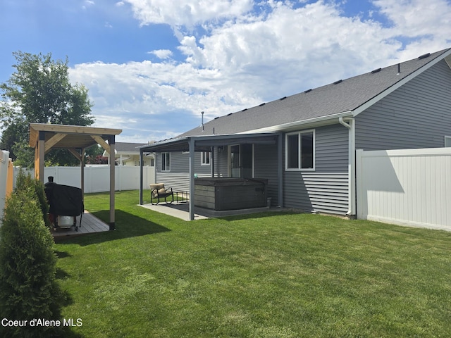 10566 N Seaside St, Hayden, ID 83835 - view of yard with a hot tub and a patio area