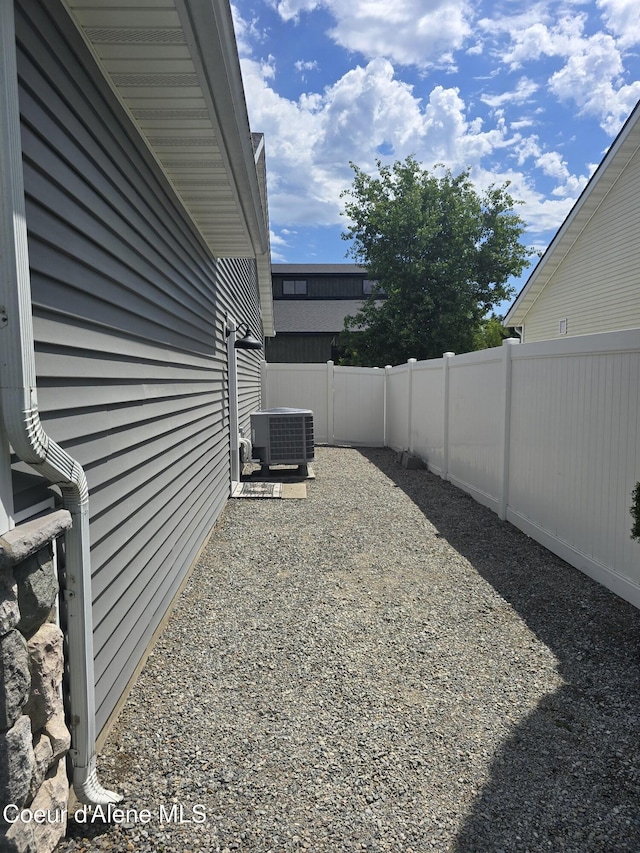 10566 N Seaside St, Hayden, ID 83835 - view of yard featuring central AC