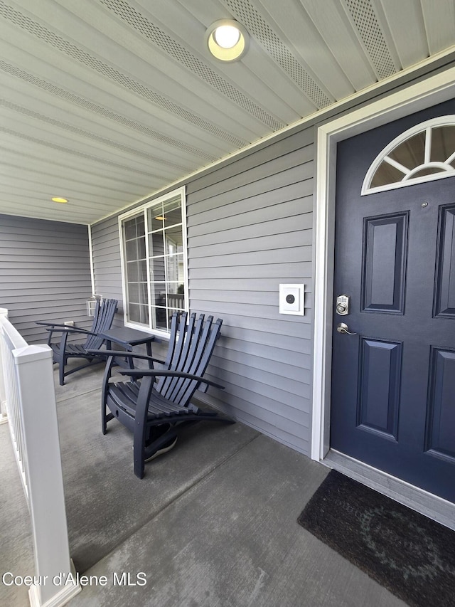10566 N Seaside St, Hayden, ID 83835 - view of exterior entry with a porch