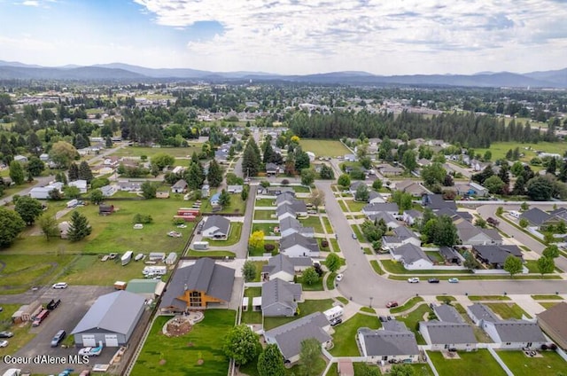 10566 N Seaside St, Hayden, ID 83835 - aerial view of property's location with a mountainous background and nearby suburban area