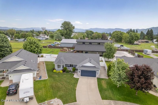 10566 N Seaside St, Hayden, ID 83835 - aerial perspective of suburban area with a mountain backdrop