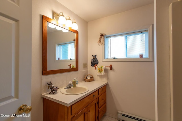 97 S Granite Bay Rd, Nordman, ID 83848 - bathroom featuring a baseboard heating unit, plenty of natural light, vanity, and decorative backsplash