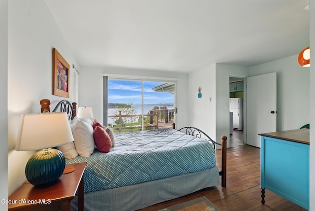 521 Aspen, Hope, ID 83836 - bedroom featuring freestanding refrigerator, wood finished floors, and access to outside