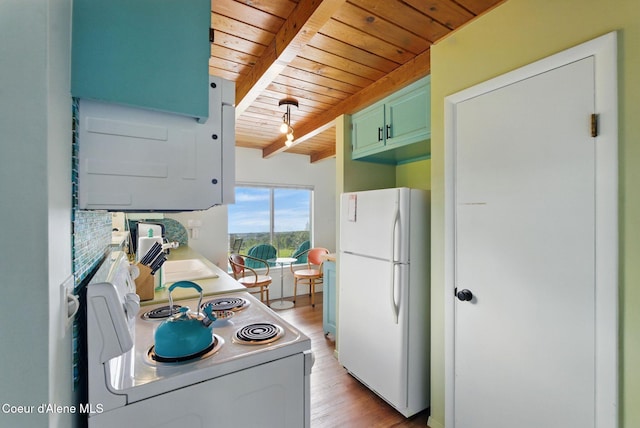 521 Aspen, Hope, ID 83836 - kitchen featuring white appliances, wooden ceiling with exposed beams, light wood-type flooring, light countertops, and a sink