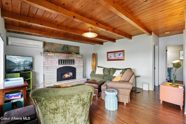 521 Aspen, Hope, ID 83836 - living room with a wall mounted AC, wood finished floors, a fireplace, and wooden ceiling with exposed beams