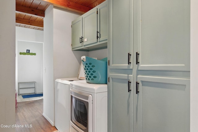 521 Aspen, Hope, ID 83836 - laundry area featuring wooden ceiling, independent washer and dryer, cabinet space, and light wood finished floors