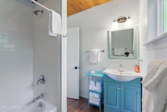 521 Aspen, Hope, ID 83836 - full bathroom with  shower combination, vanity, wood finished floors, and baseboards