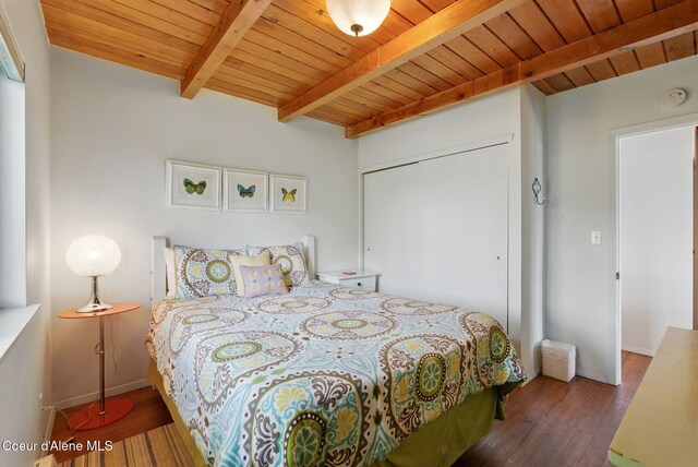 521 Aspen, Hope, ID 83836 - bedroom featuring wooden ceiling with exposed beams, wood finished floors, and a closet