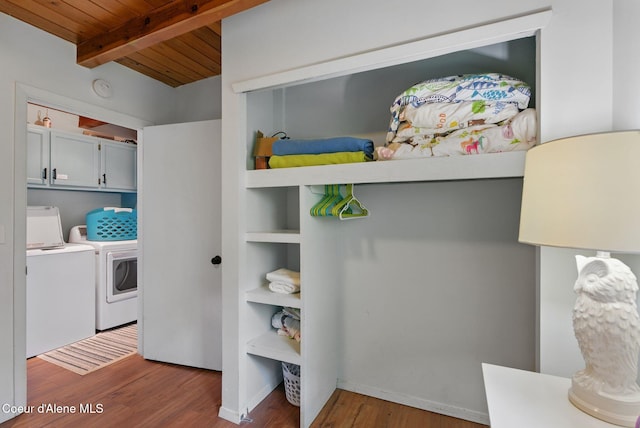 521 Aspen, Hope, ID 83836 - bedroom with washing machine and dryer, wood ceiling with exposed beams, and wood finished floors