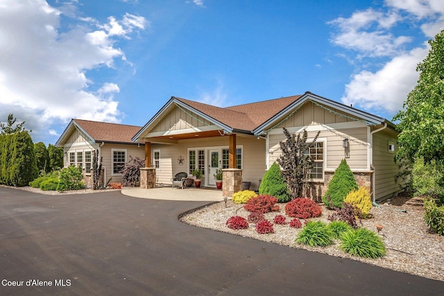 2795 Boekel Rd, Rathdrum, ID 83858 - view of front of house with board and batten siding and french doors