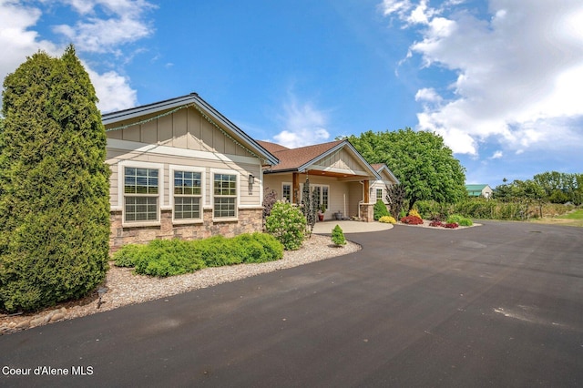 2795 Boekel Rd, Rathdrum, ID 83858 - ranch-style home featuring board and batten siding and stone siding