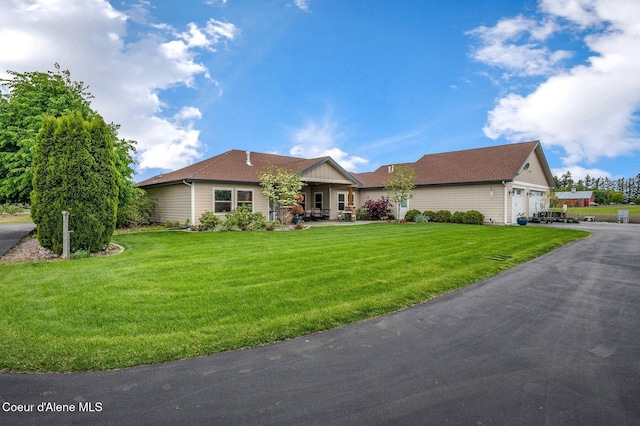 2795 Boekel Rd, Rathdrum, ID 83858 - ranch-style house featuring a front lawn